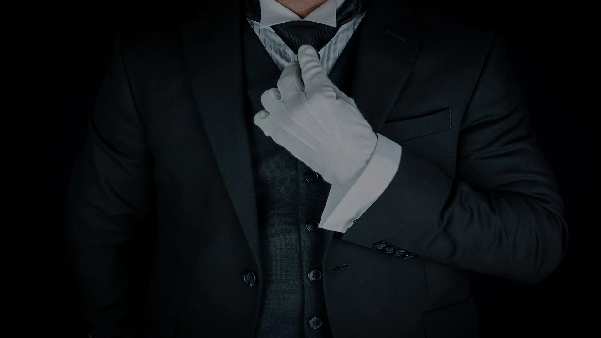 Isolated Close-Up of Butler or Concierge in Dark Suit and White